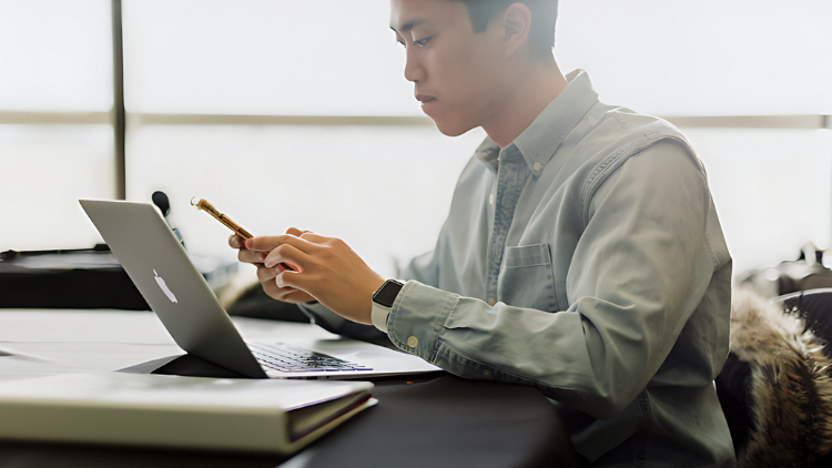 business analyst on phone bridging gap between business objectives and technological solutions