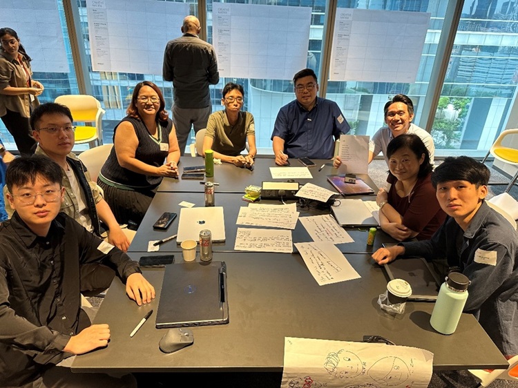 Johnny Chiang, 1FSS Health Finance Executive and colleagues at Synapxe GenAIus Challenge workshop.