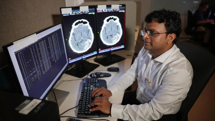 The analysis of CT brain scans has been made faster and easier with the use of AI, said senior consultant Sarat Kumar Sanamandra from the neuroradiology department of Singapore General Hospital and National Neuroscience Institute. ST PHOTO: GIN TAY